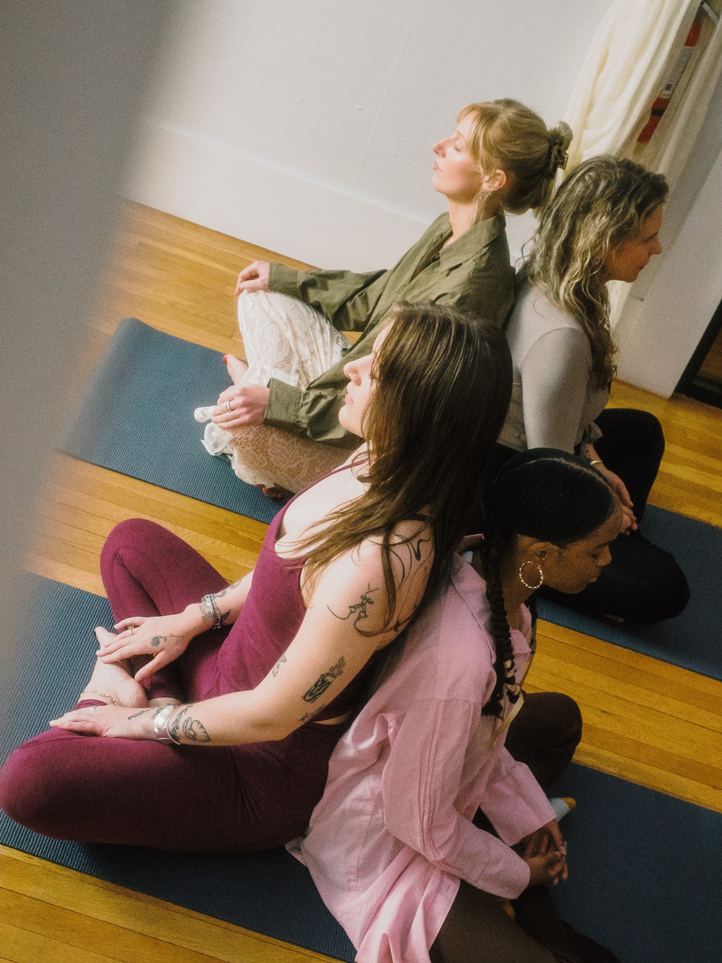 Students back to back in seated meditation
